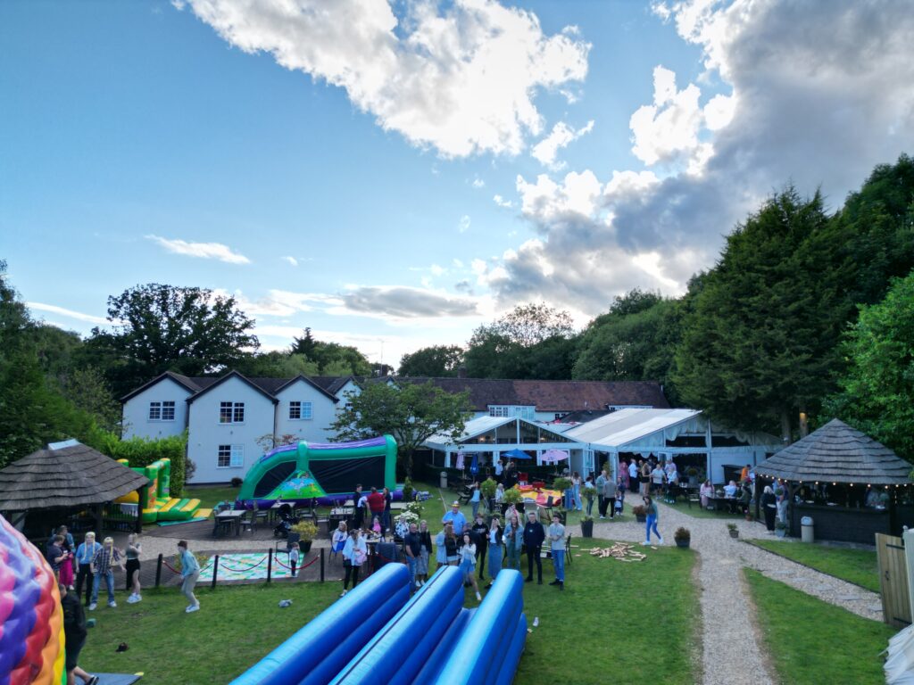 Birdseye view of employees and families socialising