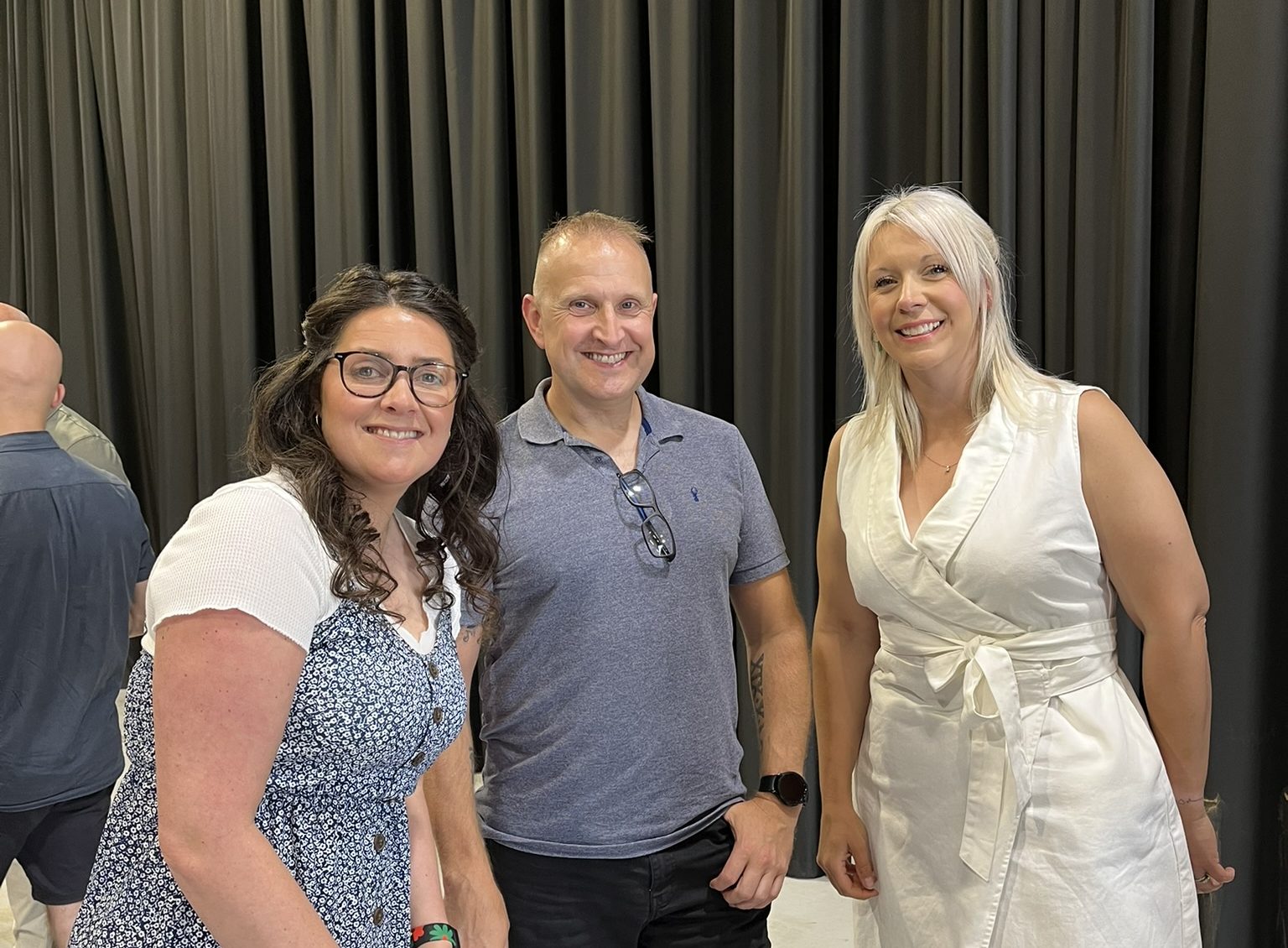 Mental Health Awareness Week - Three employees at a party together